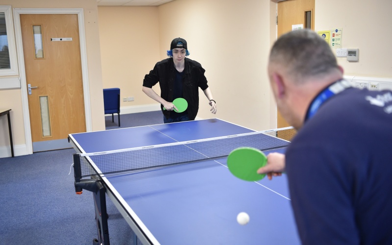 A participant playing table tennis