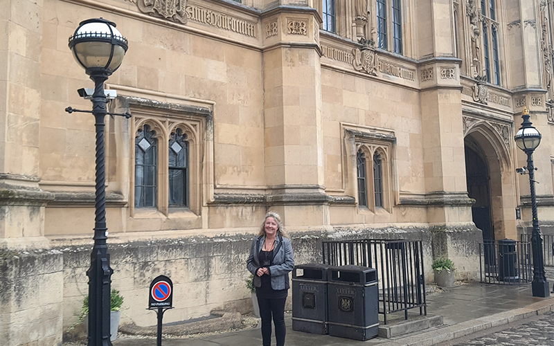 CSI Operations Manager Jane Moodie outside the Houses of Parliament 