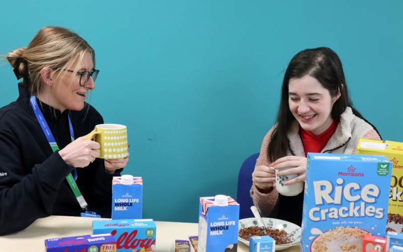 Chelsea Stobbs, Youth Engagement worker at Pendle YES Hub, talks to attendee Julie Spencer over breakfast.