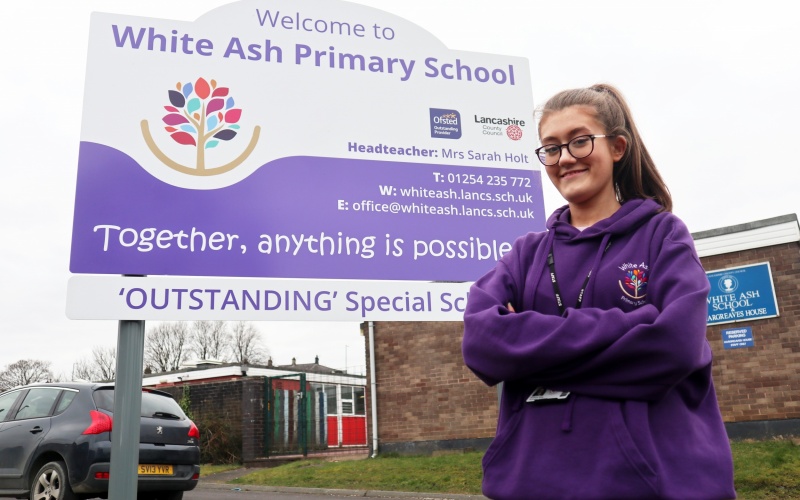 Beth outside the school