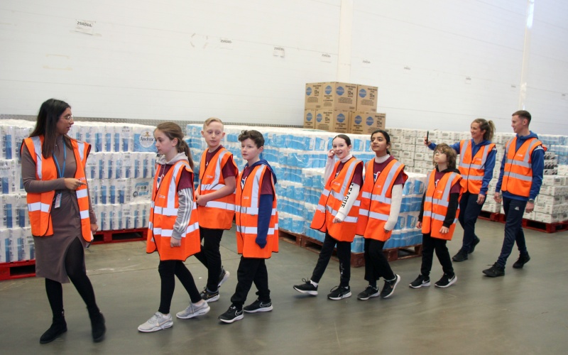 Schoolchildren take a tour of the James Hall & Co warehouse