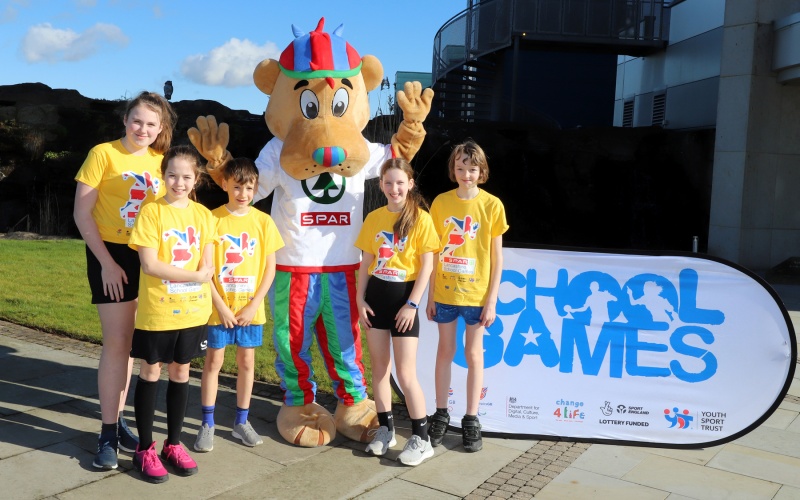 schoolchildren with the SPAR School Games Mascot