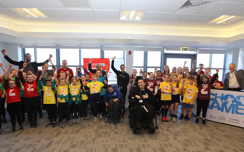Schoolchildren and guests celebrating the launch of the SPAR Lancashire School Games